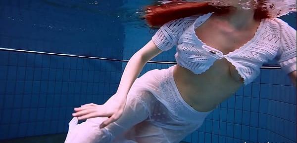  Redhead Marketa in a white dress in the pool
